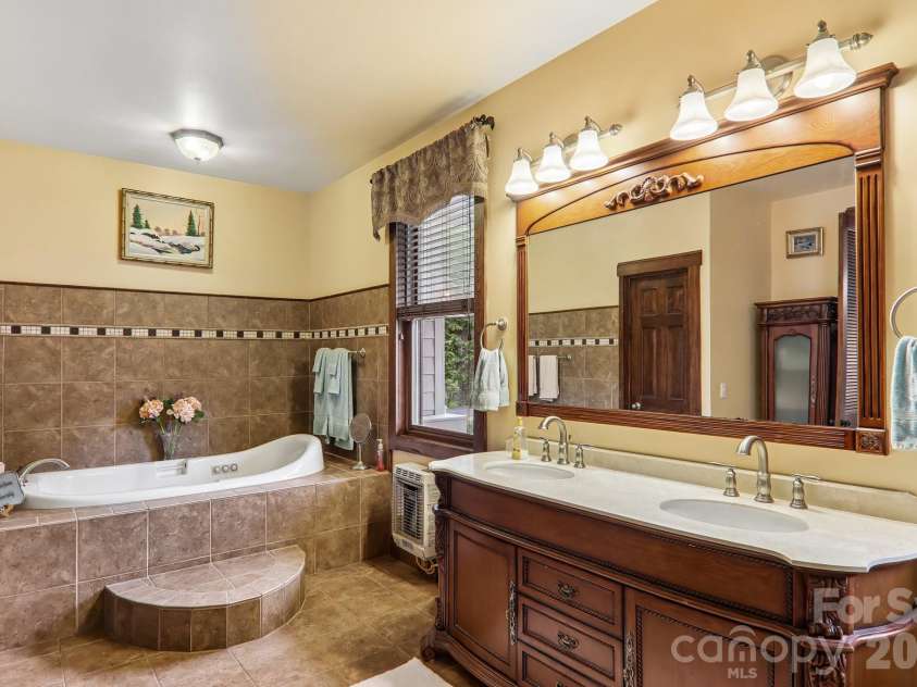 519 Susanna Cove Road, Mars Hill, NC 28754.  MLS# CAR4368251, YatesRealty ID 23179. Primary Bath w/Soaking Tub