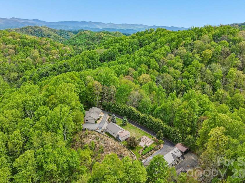 519 Susanna Cove Road, Mars Hill, NC 28754.  MLS# CAR4368251, YatesRealty ID 23179. Private Wooded Compound