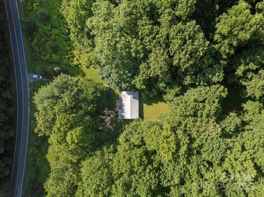 790 Thompson Road, Saluda, NC 28773.  MLS# CAR4272075, YatesRealty ID 23192. Arial view of the rare flat parcel