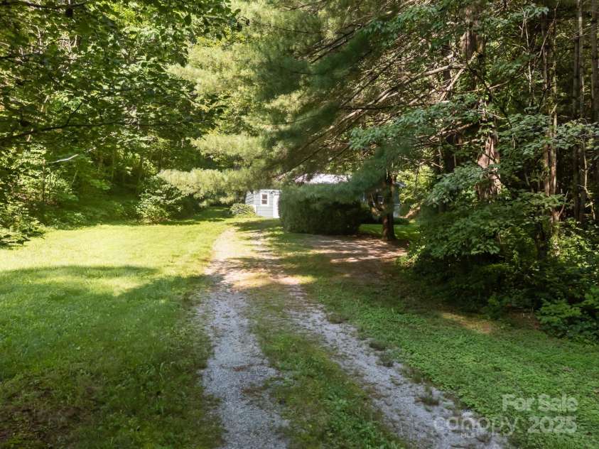 790 Thompson Road, Saluda, NC 28773.  MLS# CAR4272075, YatesRealty ID 23192. Long flat driveway