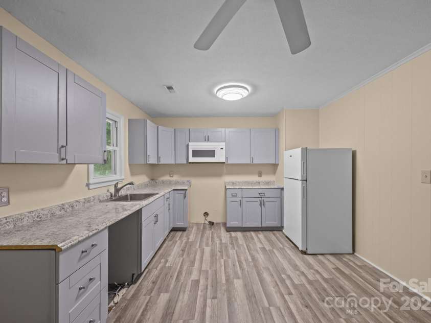 790 Thompson Road, Saluda, NC 28773.  MLS# CAR4272075, YatesRealty ID 23192. Spacious kitchen with ample counter space