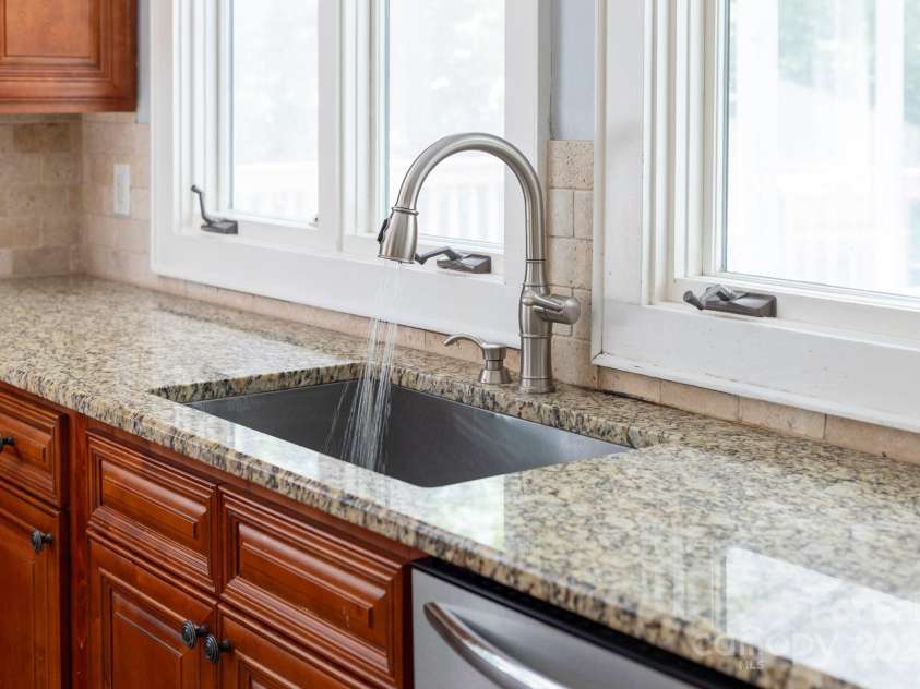512 Saint Cloud Drive, Statesville, NC 28625.  MLS# CAR4286600, YatesRealty ID 23201. Kitchen sink overlooks backyard.
