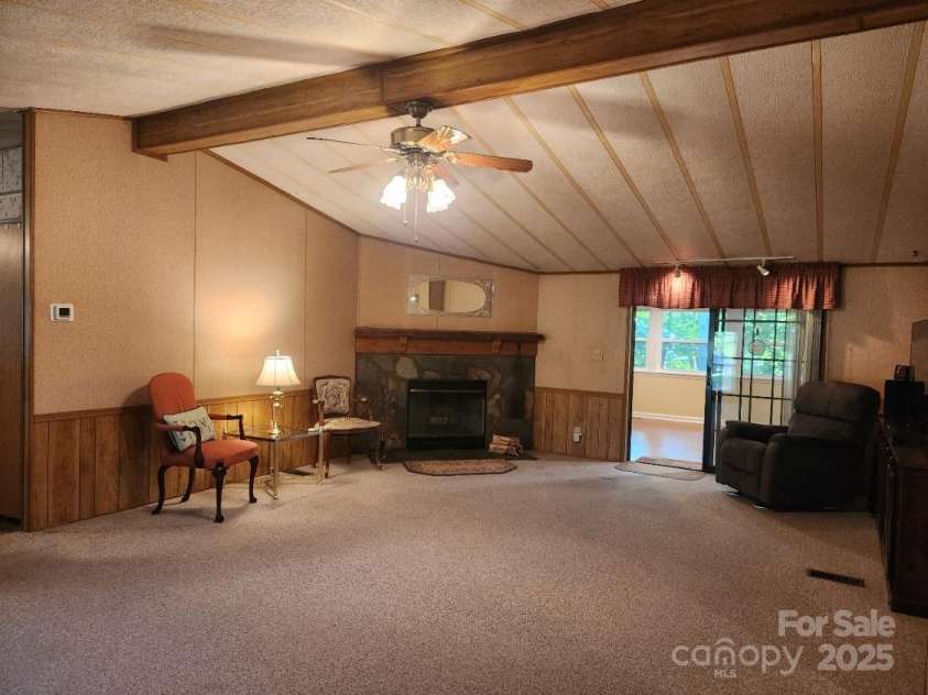 2461 Ridgecrest Drive, Stanley, NC 28164.  MLS# CAR4263475, YatesRealty ID 23202. LIVING ROOM WITH WOOD BURNING FP