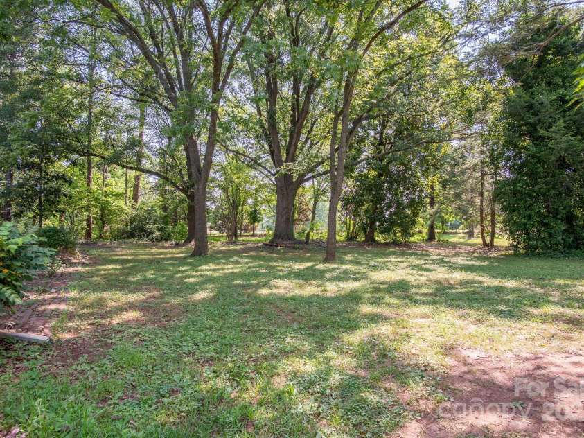 109 Fulton Street, Kings Mountain, NC 28086.  MLS# CAR4289026, YatesRealty ID 2321. Side yard of Fulton St next to Commercial Property