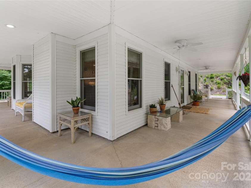 109 Paradise Circle, Clyde, NC 28721.  MLS# CAR4239920, YatesRealty ID 23219. Expansive covered porch brings the living outside!