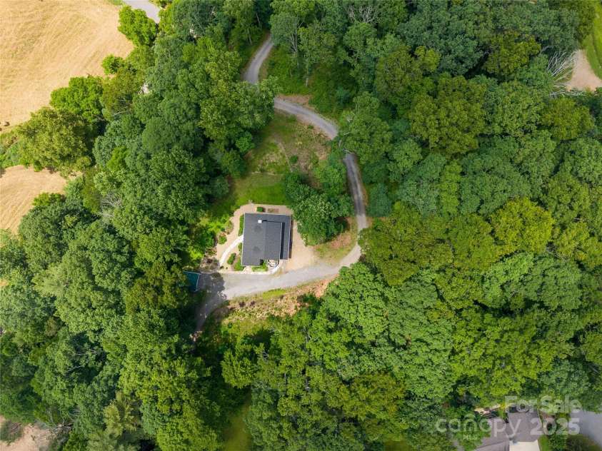109 Paradise Circle, Clyde, NC 28721.  MLS# CAR4239920, YatesRealty ID 23219. With over 5 acres of land there's plenty of room and privacy!