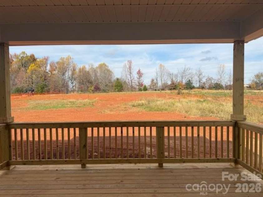 1230 Gardenia Drive, Mt Ulla, NC 28125.  MLS# CAR4299918, YatesRealty ID 23219. 16 X 14 covered deck overlooking level, private backyard on .93 acres!