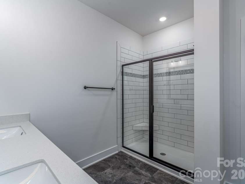 1230 Gardenia Drive, Mt Ulla, NC 28125.  MLS# CAR4299918, YatesRealty ID 23219. 5ft tiled shower with bench