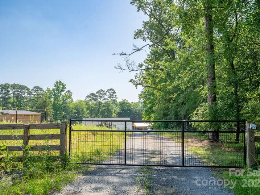 16132 Mclester Road, Oakboro, NC 28129.  MLS# CAR4263012, YatesRealty ID 23221. Gated entry