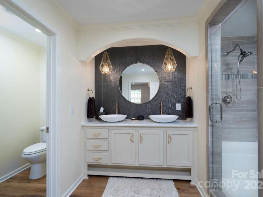 16132 Mclester Road, Oakboro, NC 28129.  MLS# CAR4263012, YatesRealty ID 23221. Primary bath with double sinks