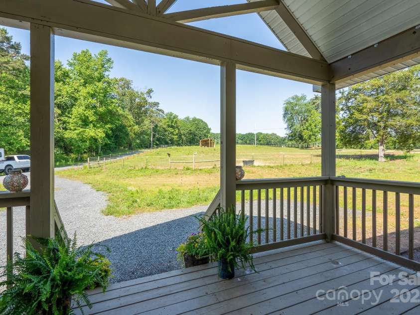 16132 Mclester Road, Oakboro, NC 28129.  MLS# CAR4263012, YatesRealty ID 23221. View from front porch