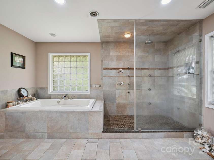14411 Eastfield Road, Huntersville, NC 28078.  MLS# CAR4273593, YatesRealty ID 23226. Shower has 8 heads