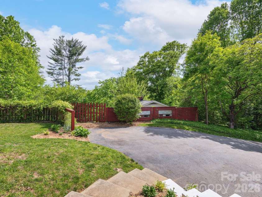 33 Pinehurst Road, Asheville, NC 28805.  MLS# CAR4374553, YatesRealty ID 23231. Backyard Concrete Steps to Paved Drive