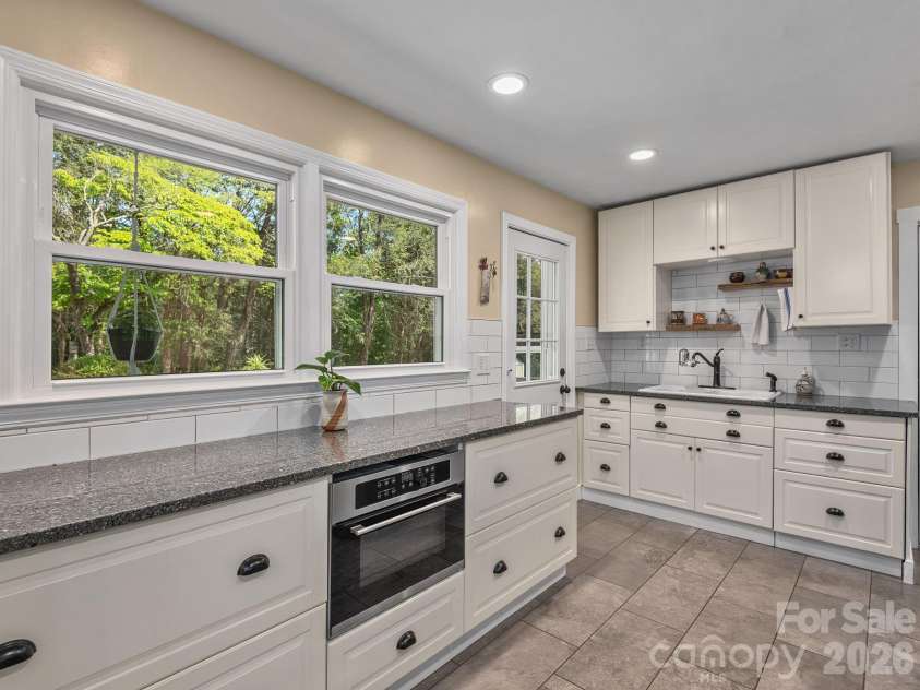 33 Pinehurst Road, Asheville, NC 28805.  MLS# CAR4374553, YatesRealty ID 23231. Kitchen Exits onto New Rear Decking