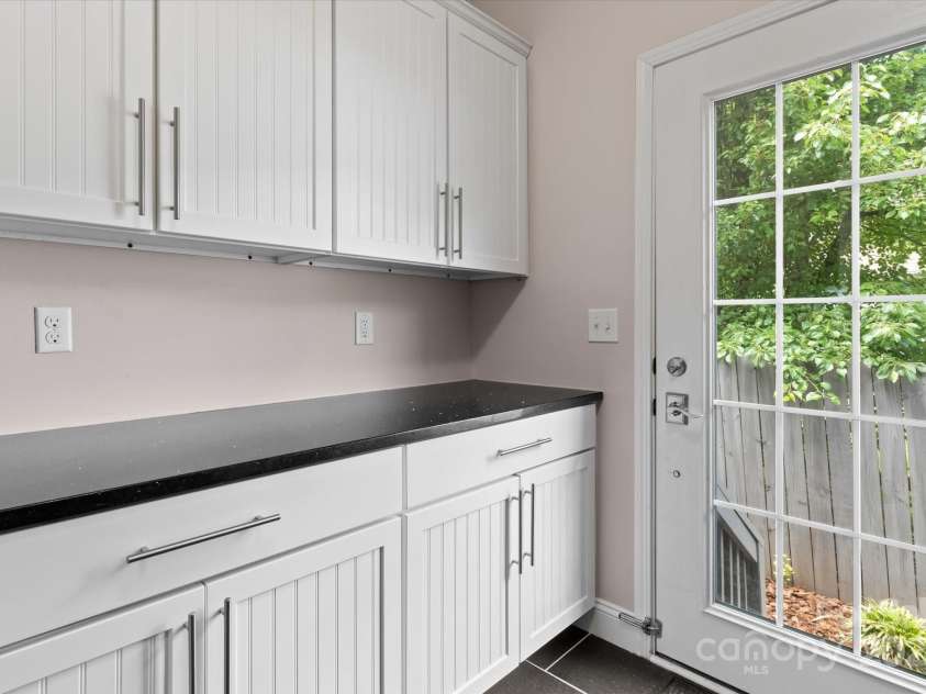 1201 Pegram Street, Charlotte, NC 28205.  MLS# CAR4257783, YatesRealty ID 23234. Laundry/ultility room has plenty of cabinets for storage