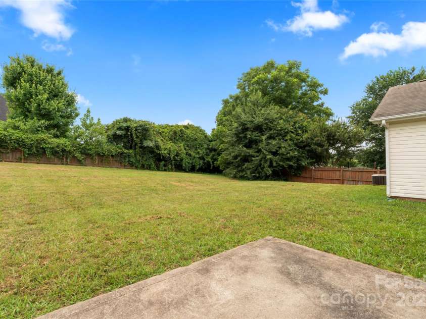 7616 Shiny Meadow Lane, Charlotte, NC 28215.  MLS# CAR4275110, YatesRealty ID 23237. Large fenced-in backyard
