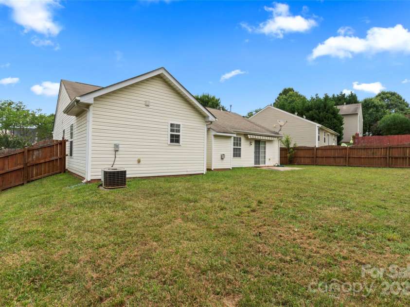 7616 Shiny Meadow Lane, Charlotte, NC 28215.  MLS# CAR4275110, YatesRealty ID 23237. Large fenced-in backyard
