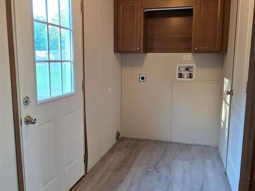 78 Buck Branch Road, Mill Spring, NC 28756.  MLS# CAR4381478, YatesRealty ID 23248. Laundry-mud room with rear yard & kitchen access