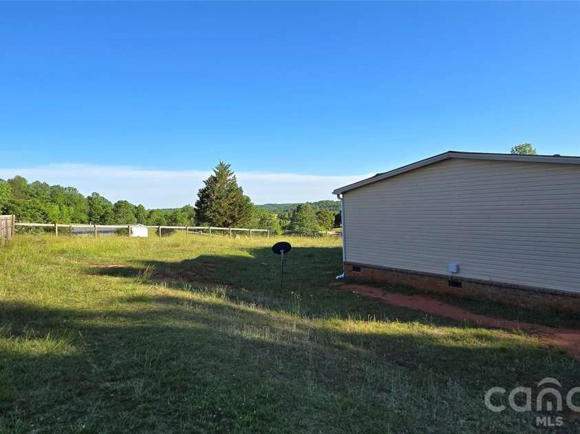 78 Buck Branch Road, Mill Spring, NC 28756.  MLS# CAR4381478, YatesRealty ID 23248. Rear yard