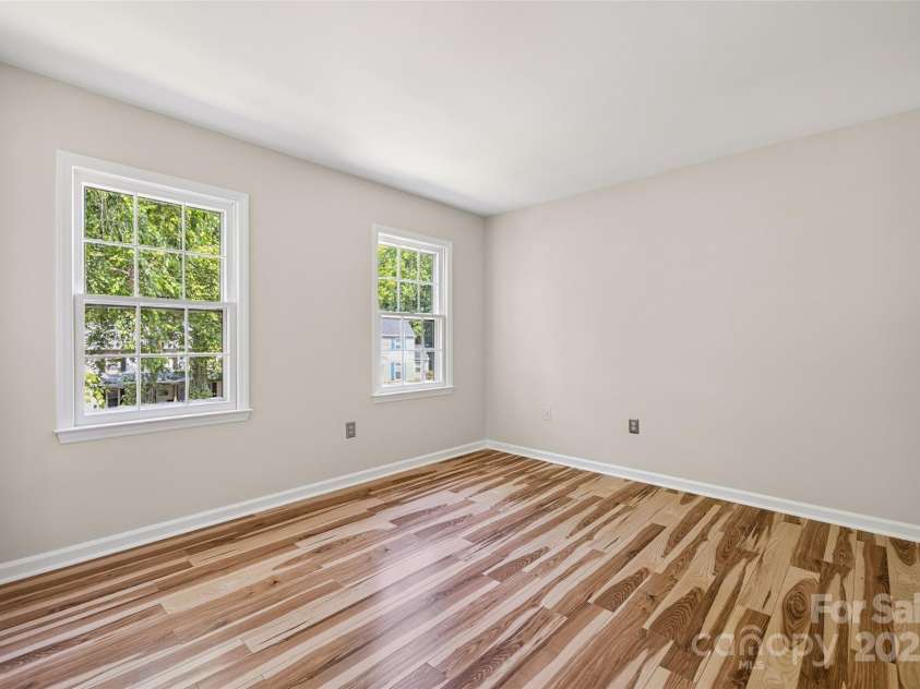4911 Rivergreen Lane, Charlotte, NC 28227.  MLS# CAR4272250, YatesRealty ID 23250. Bedroom #2 upstairs with laminate flooring