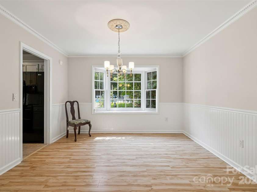 4911 Rivergreen Lane, Charlotte, NC 28227.  MLS# CAR4272250, YatesRealty ID 23250. Formal dining room with bay windows overlooking the pool