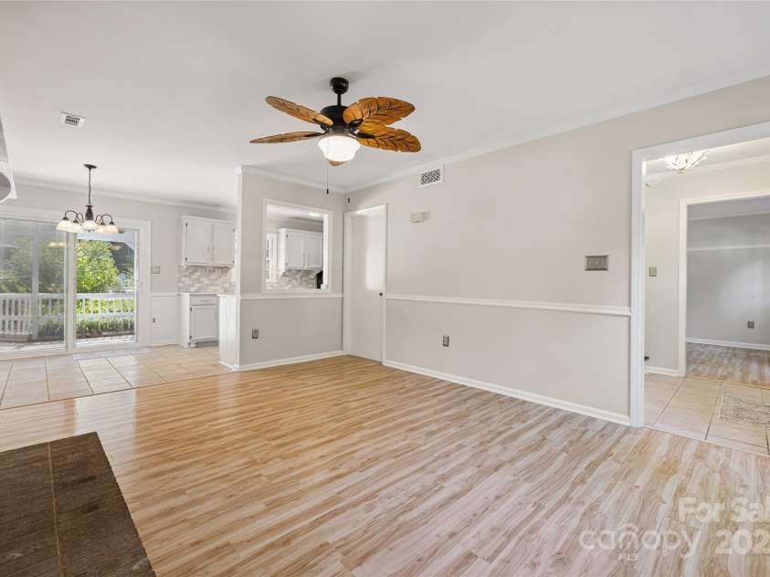 4911 Rivergreen Lane, Charlotte, NC 28227.  MLS# CAR4272250, YatesRealty ID 23250. Living room open to breakfast area and kitchen