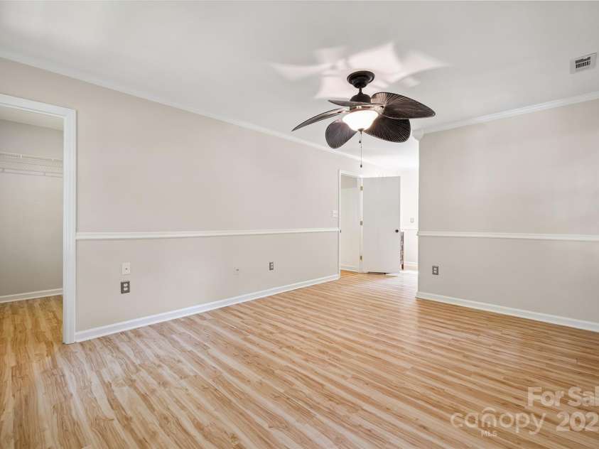 4911 Rivergreen Lane, Charlotte, NC 28227.  MLS# CAR4272250, YatesRealty ID 23250. Primary bedroom with 2 walk-in closets