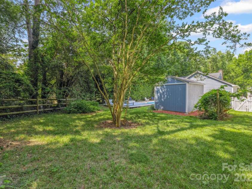 4911 Rivergreen Lane, Charlotte, NC 28227.  MLS# CAR4272250, YatesRealty ID 23250. Private, lush backyard