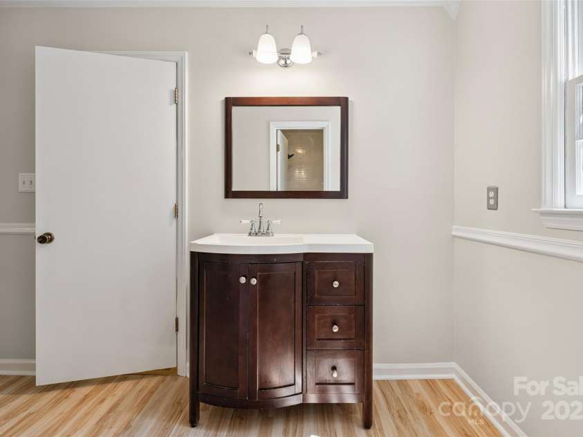 4911 Rivergreen Lane, Charlotte, NC 28227.  MLS# CAR4272250, YatesRealty ID 23250. Vanity in primary bedroom