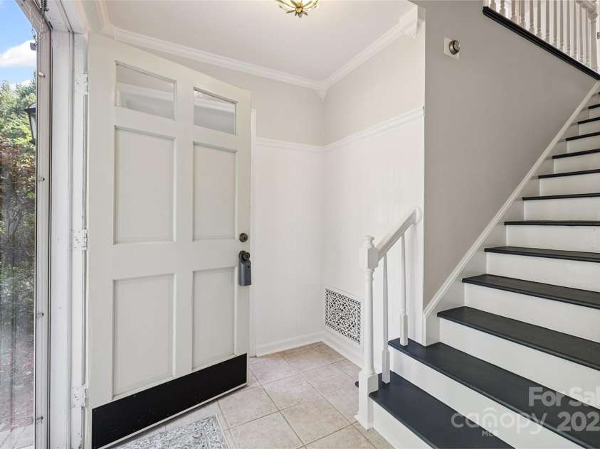 4911 Rivergreen Lane, Charlotte, NC 28227.  MLS# CAR4272250, YatesRealty ID 23250. Welcoming main entry and wooden staircase