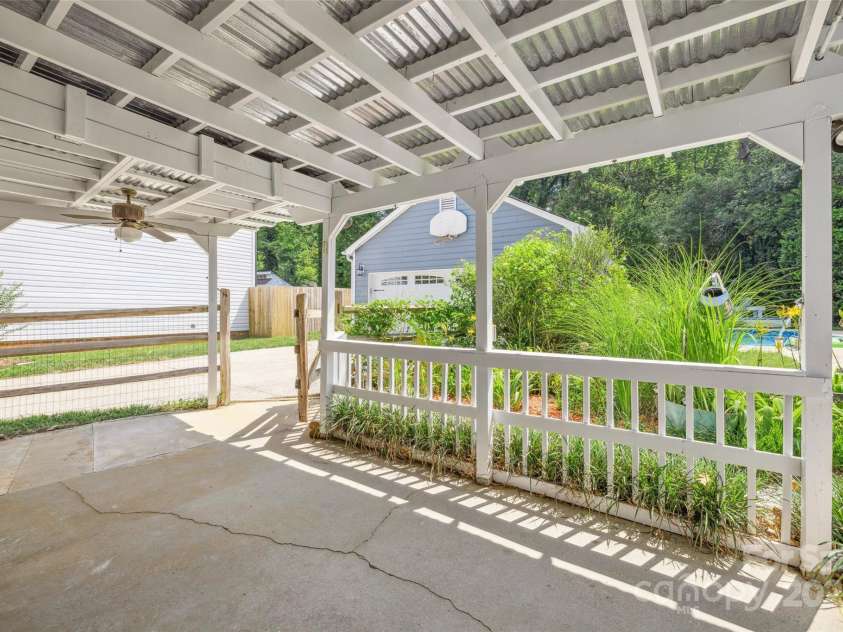 4911 Rivergreen Lane, Charlotte, NC 28227.  MLS# CAR4272250, YatesRealty ID 23250. You will love relaxing on this covered porch overlooking the pool
