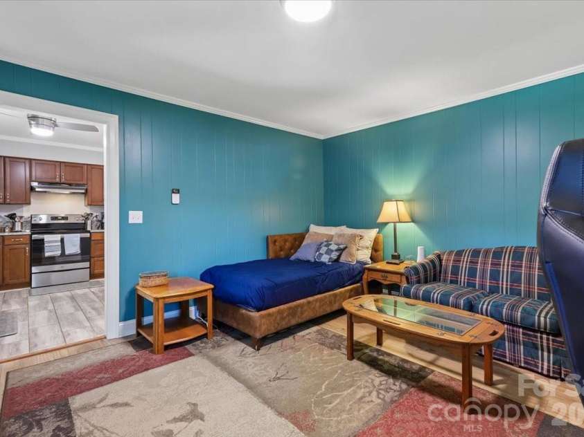 13507 Four Oaks Lane, Matthews, NC 28105.  MLS# CAR4383219, YatesRealty ID 23254. Den with gas fireplace