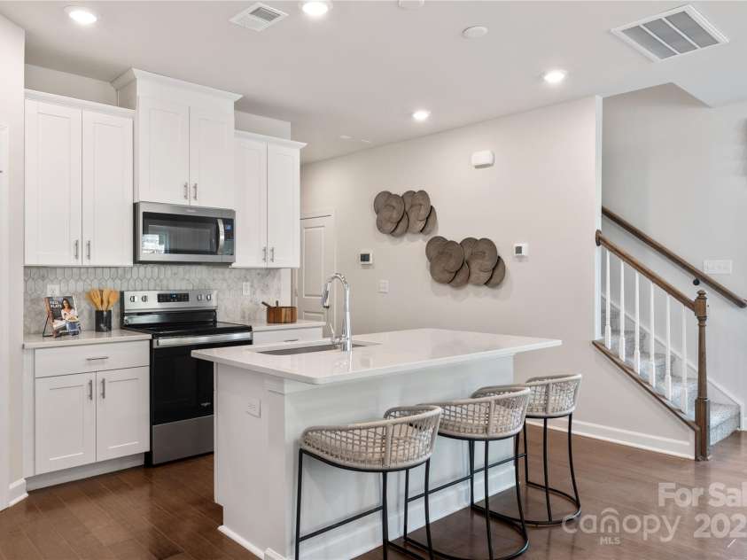 5054 Kellaher Place, Charlotte, NC 28216.  MLS# CAR4215713, YatesRealty ID 23255. Photo is not of the actual home but is an inspirational photo of builder’s model home and may depict options, furnishings, and/or decorator features that are not included.
