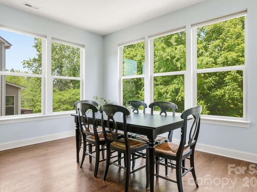 522 Iron Horse Lane, Midland, NC 28107.  MLS# CAR4374807, YatesRealty ID 23256. Kitchen dining overlooking the trees