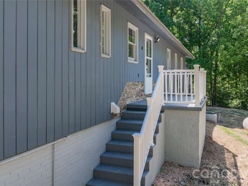 7362 Volunteer Rescue Road, Denton, NC 27239.  MLS# CAR4370916, YatesRealty ID 23257. Steps to the dining area from back yard