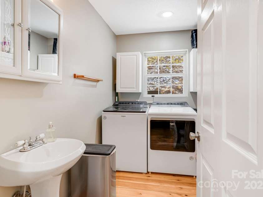 110 Red Wolf Lane, Mars Hill, NC 28754.  MLS# CAR4239848, YatesRealty ID 2326. Main floor laundry room with a half bath