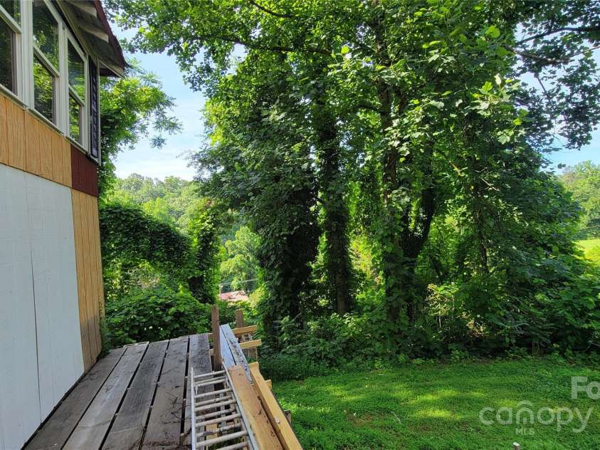 160 Cleveland Road, Tryon, NC 28782.  MLS# CAR4274322, YatesRealty ID 23261. Backyard from right of basement