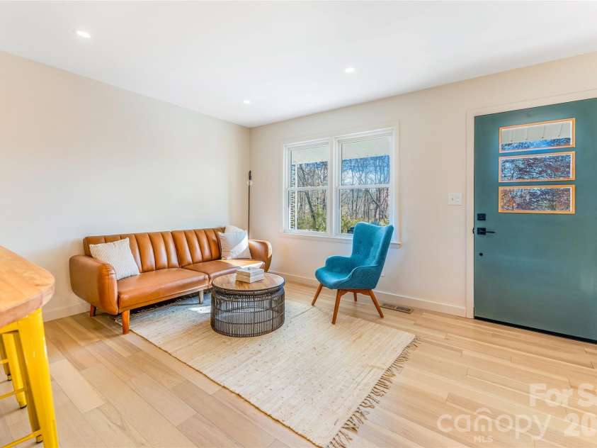 11 Clinton Street, Weaverville, NC 28787.  MLS# CAR4351286, YatesRealty ID 23270. Step inside to the open floor plan offering sitting area, kitchen and dining