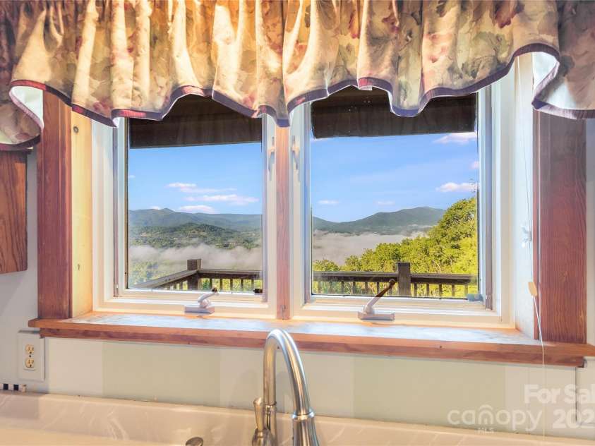 1087 Brigadoon Drive, Clyde, NC 28721.  MLS# CAR4276623, YatesRealty ID 23272. Amazing view