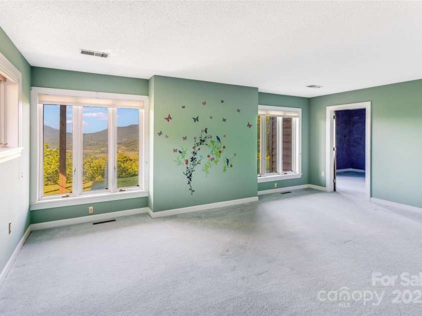 1087 Brigadoon Drive, Clyde, NC 28721.  MLS# CAR4276623, YatesRealty ID 23272. Bedroom 2- lower level