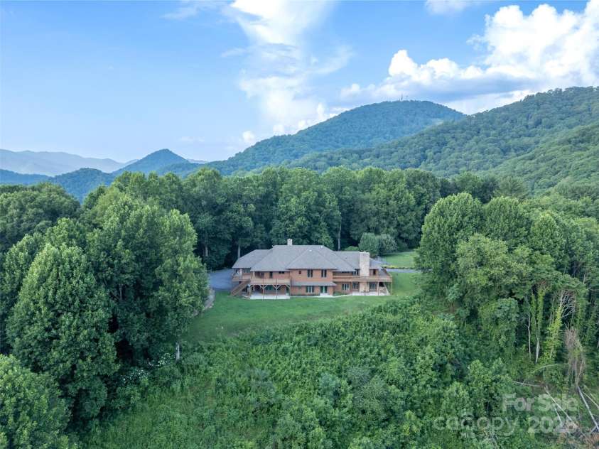 1087 Brigadoon Drive, Clyde, NC 28721.  MLS# CAR4276623, YatesRealty ID 23272. Drone view of property