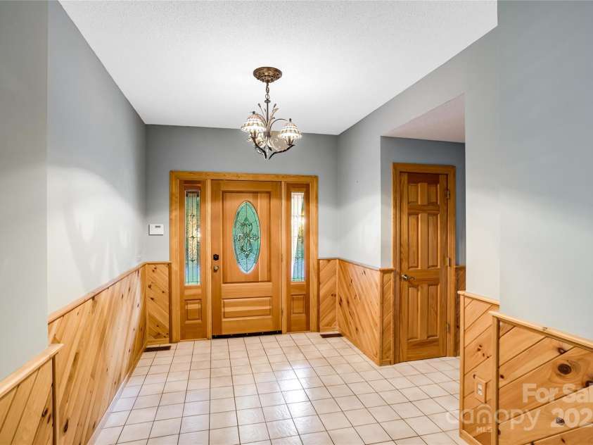 1087 Brigadoon Drive, Clyde, NC 28721.  MLS# CAR4276623, YatesRealty ID 23272. Warm and welcoming entry