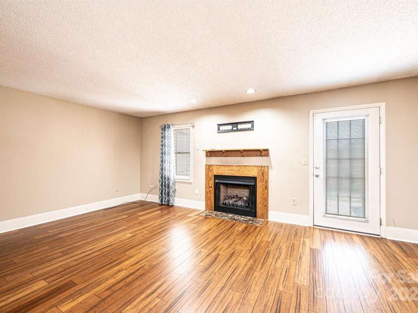 709 21st Avenue, Hickory, NC 28601.  MLS# CAR4276876, YatesRealty ID 23275. Living Room with gas logs fireplace