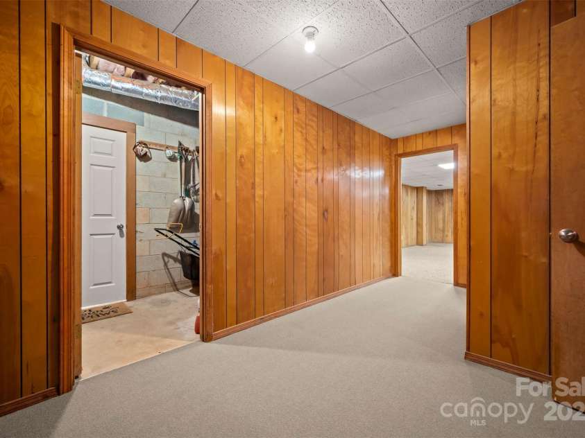 467 Winners Circle, Tryon, NC 28782.  MLS# CAR4276645, YatesRealty ID 23282. Basement Entry area to finished Recreation Room and utility room
