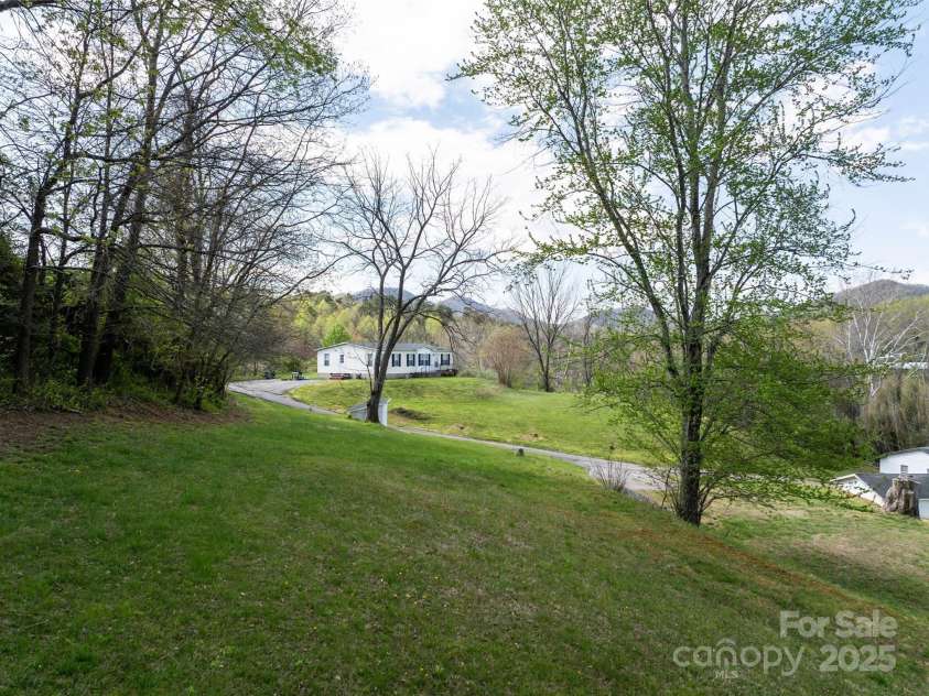 20 & 28 Toby Drive, Asheville, NC 28806.  MLS# CAR4261356, YatesRealty ID 23300. Extra space for potential development.