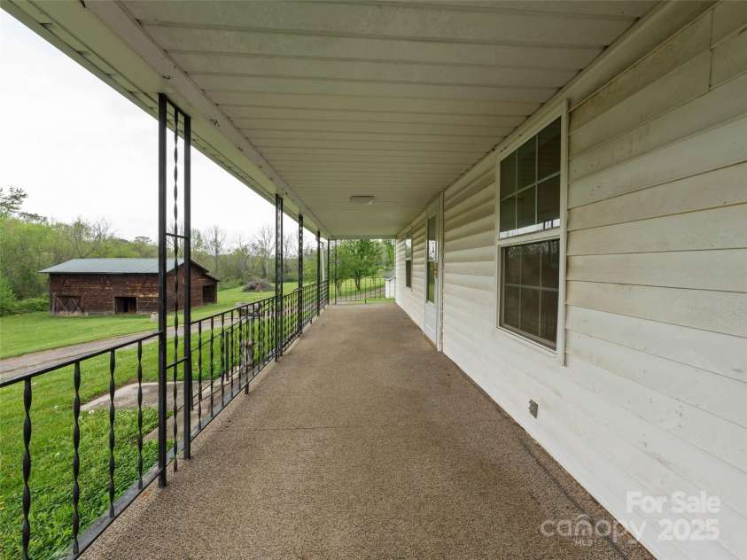 20 & 28 Toby Drive, Asheville, NC 28806.  MLS# CAR4261356, YatesRealty ID 23300. Relax on the front porch listen to the creek trickle and overlook your barn!