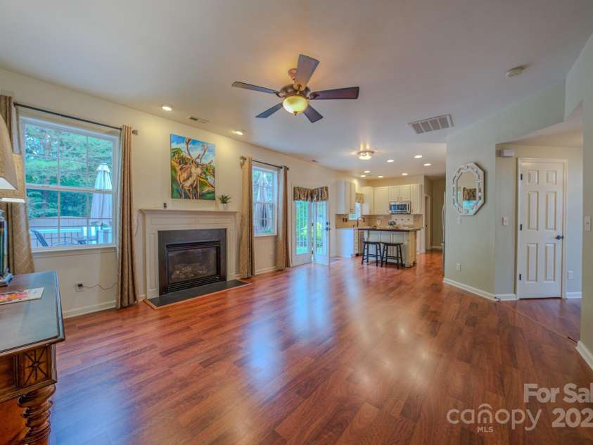 36 Stone River Drive, Asheville, NC 28804.  MLS# CAR4268666, YatesRealty ID 23301. Large open concept living room with access to the backyard and kitchen.