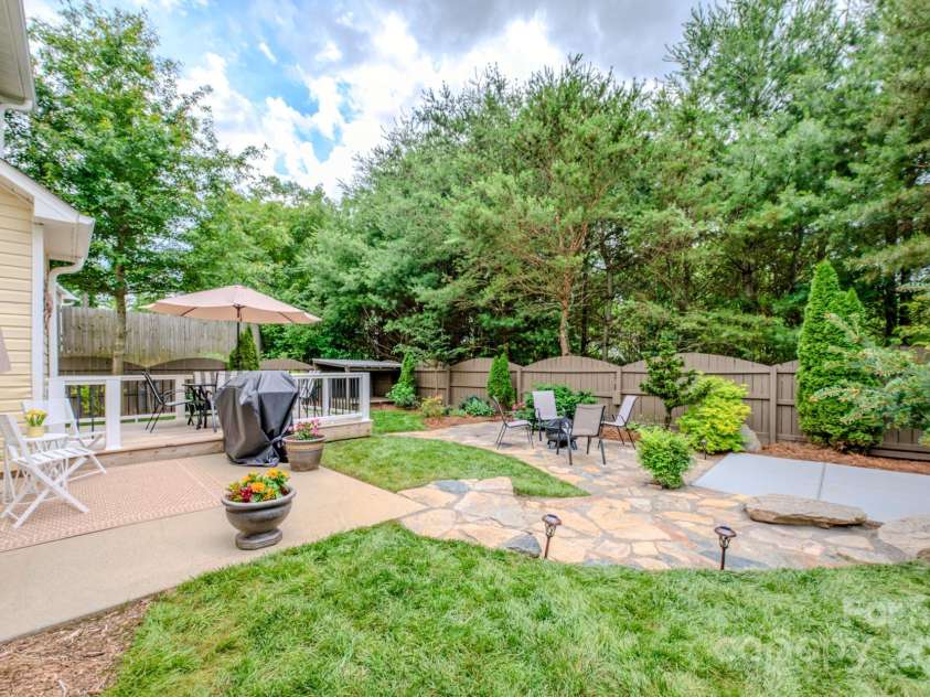 36 Stone River Drive, Asheville, NC 28804.  MLS# CAR4268666, YatesRealty ID 23301. Multiple spots to entertain and enjoy this amazing backyard. Add a hot tub, some pets, and enjoy this private space.
