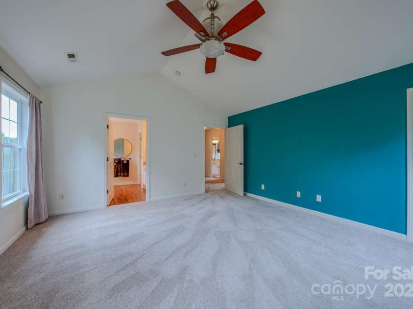 36 Stone River Drive, Asheville, NC 28804.  MLS# CAR4268666, YatesRealty ID 23301. Primary bedroom has a large walk-in closet with built in organization system.