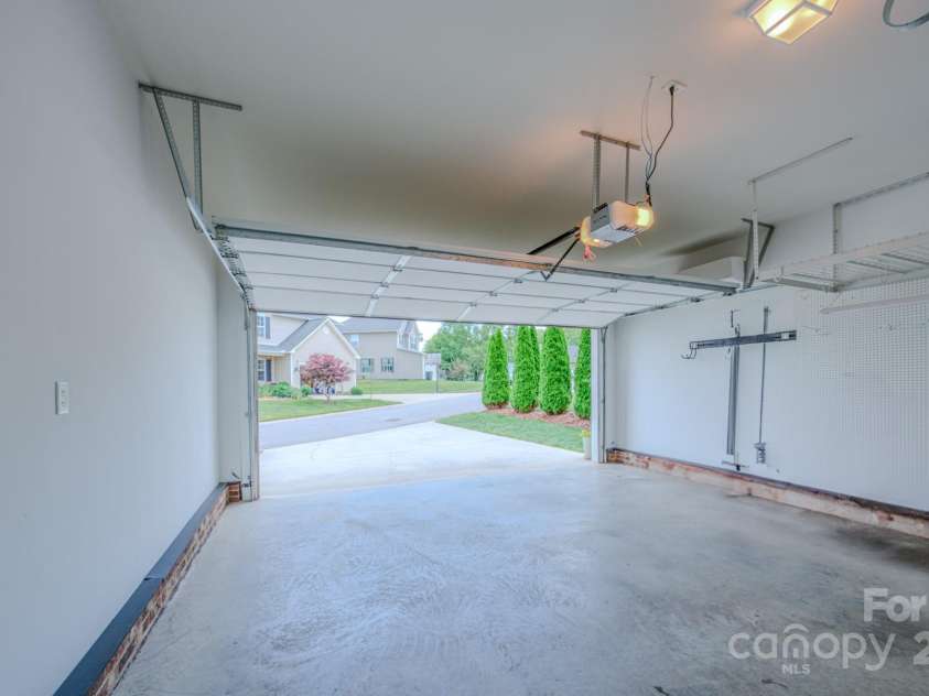 36 Stone River Drive, Asheville, NC 28804.  MLS# CAR4268666, YatesRealty ID 23301. Two car garage with mini-split for comfort or flex-use as gym/game area.